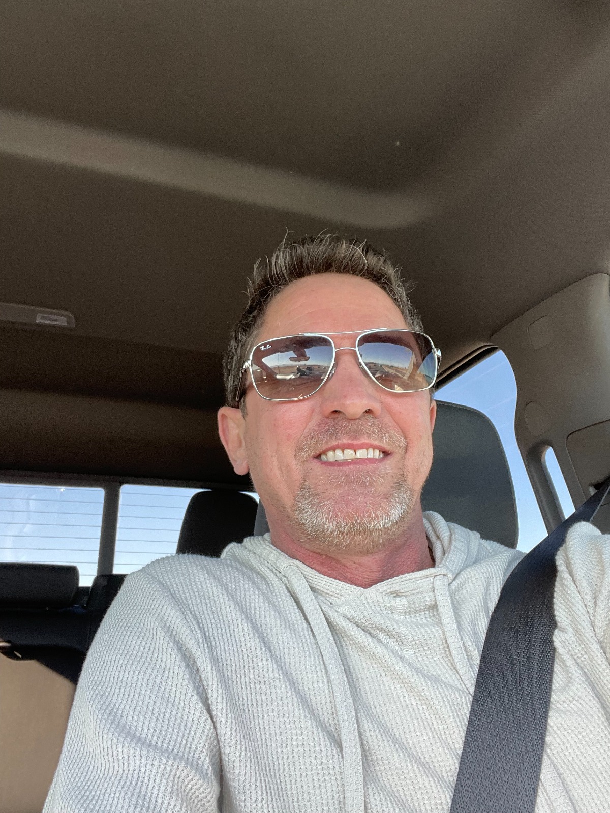 Shawn Spencer in his car, aviator sunglasses, on the move